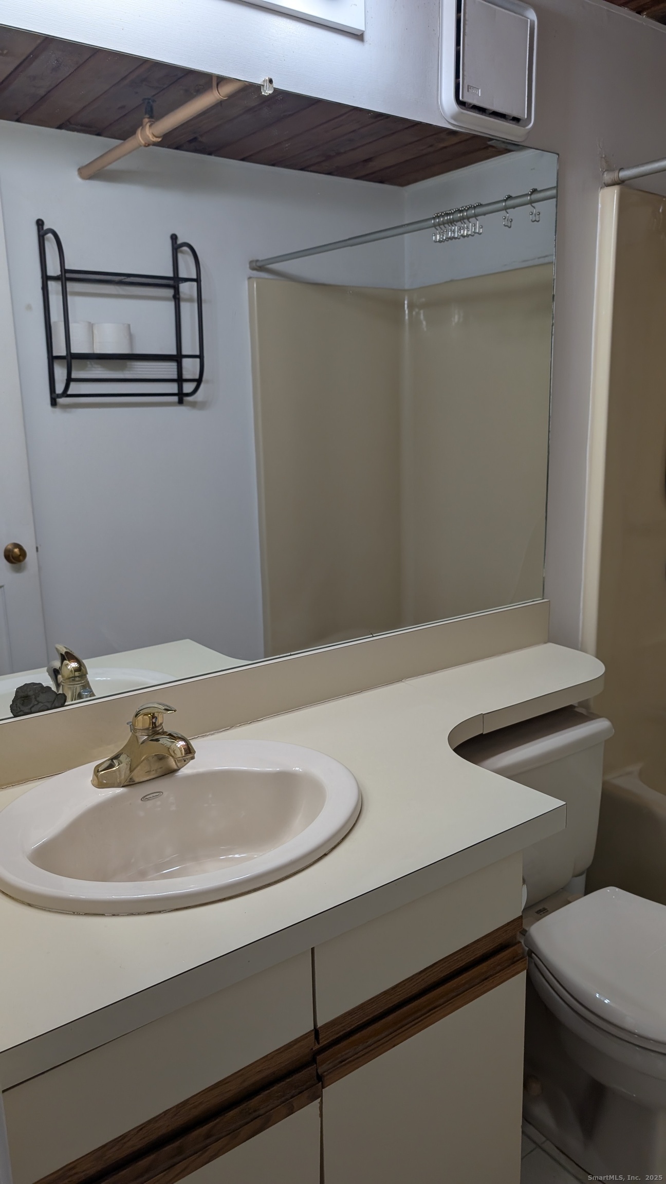 839 Main Street, Unit 61 Torrington, CT 06790 - Photo 13 of 18 a bathroom with a sink and a toilet