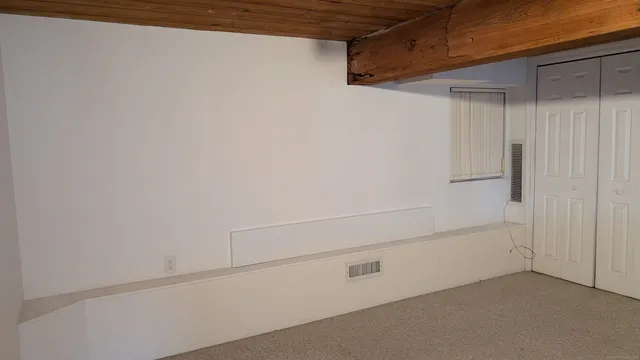 a view of an empty walk in closet