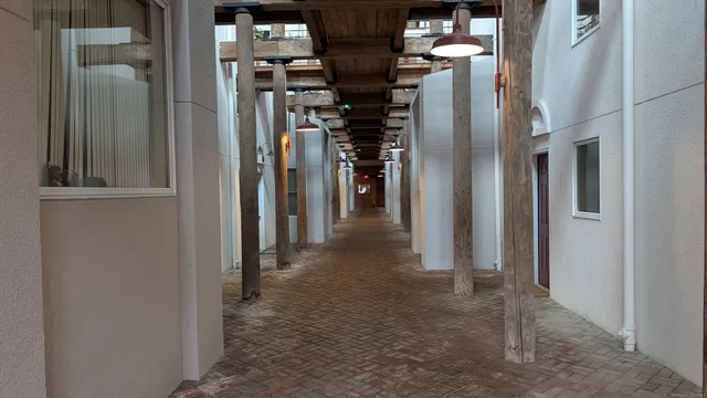 a view of a hallway with two of room