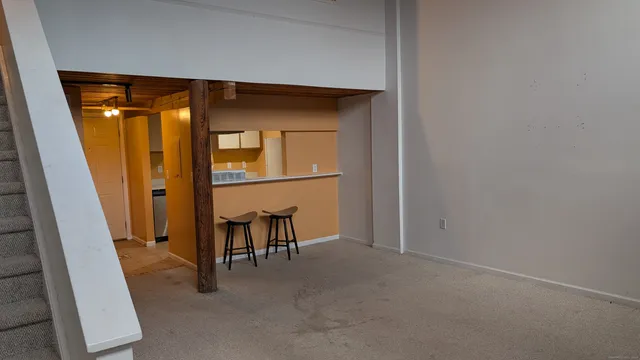 a view of livingroom with furniture and a window