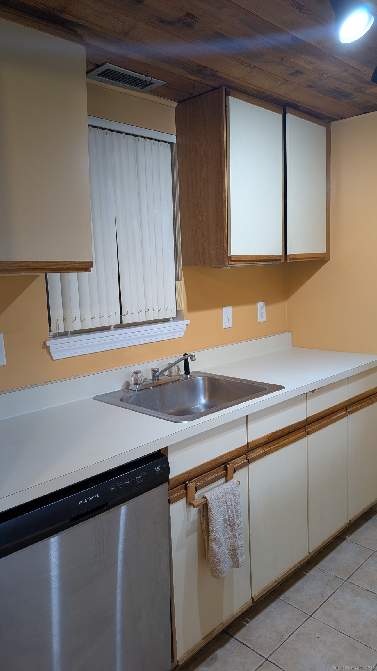 839 Main Street, Unit 61 Torrington, CT 06790 - Photo 6 of 18 a kitchen with a sink and a mirror