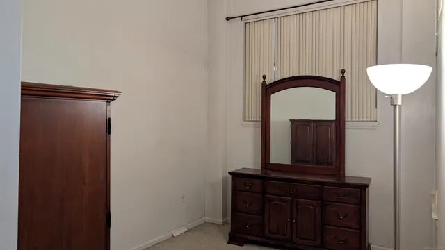 a bathroom with a mirror and a sink