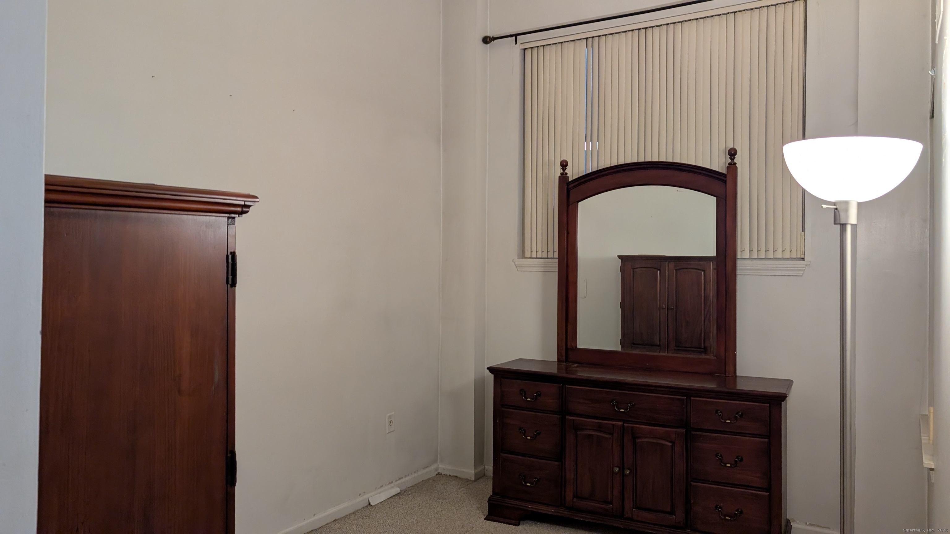 839 Main Street, Unit 61 Torrington, CT 06790 - Photo 9 of 18 a bathroom with a mirror and a sink