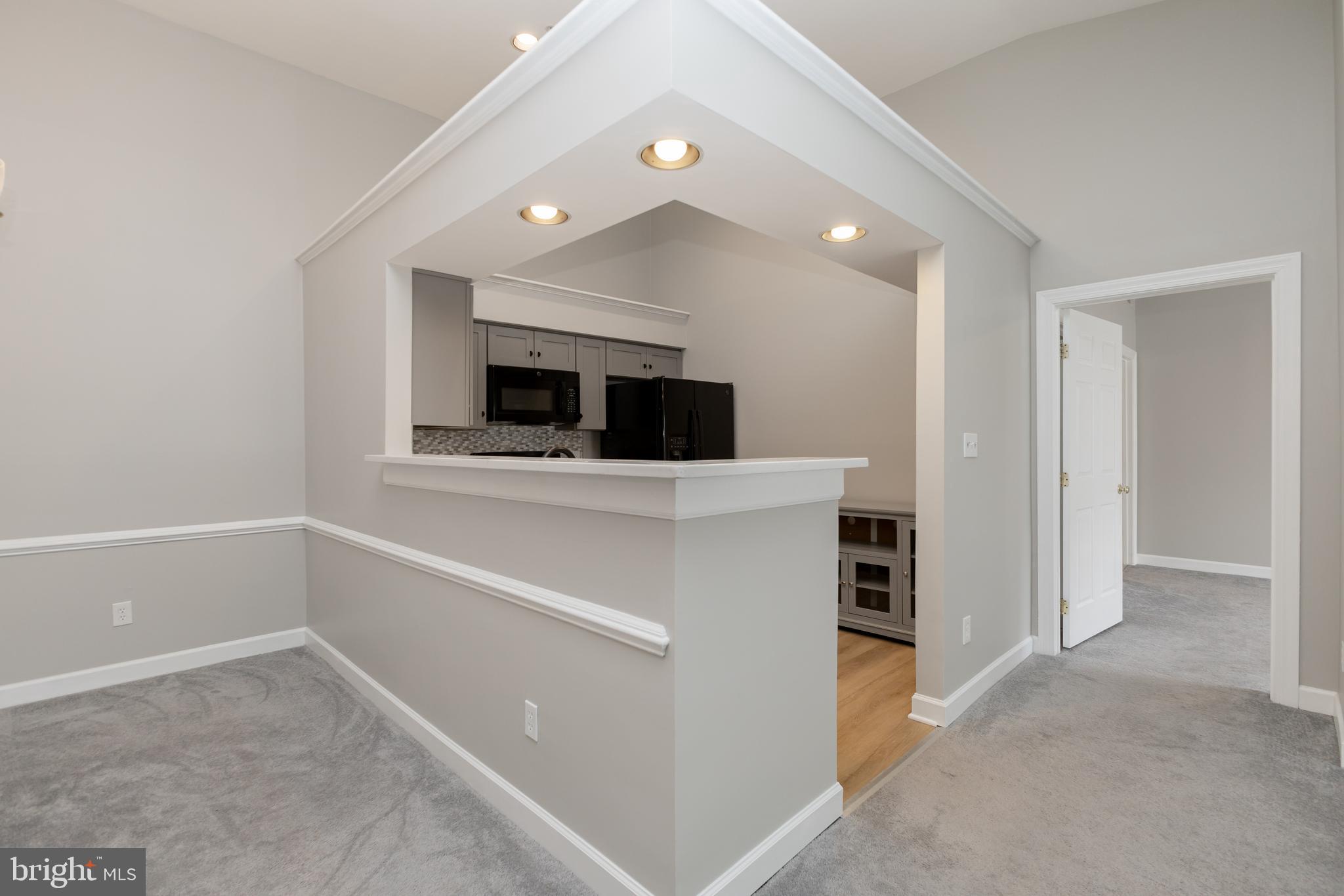 8311 Bluebird Way, Unit K Lorton, VA 22079 - Photo 11 of 25 a view of an empty room and a fireplace