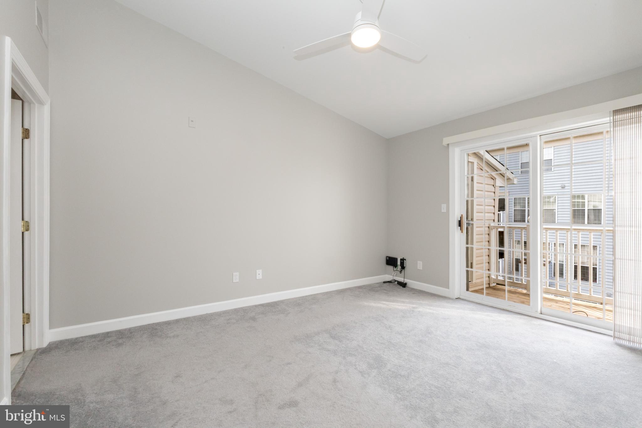 8311 Bluebird Way, Unit K Lorton, VA 22079 - Photo 15 of 25 an empty room with windows