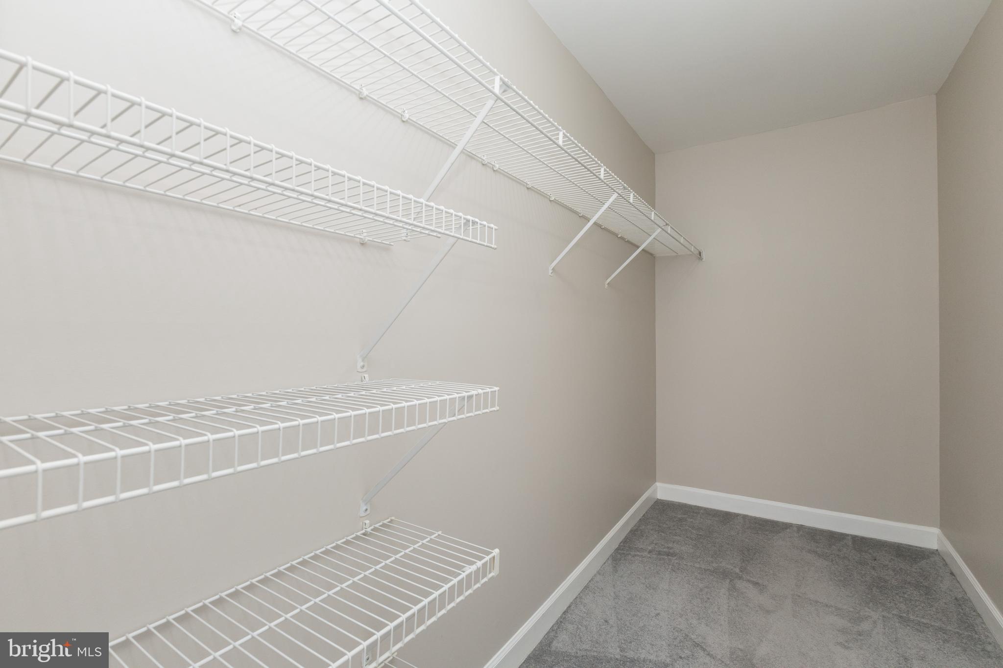 8311 Bluebird Way, Unit K Lorton, VA 22079 - Photo 18 of 25 a view of a room with racks on the wall