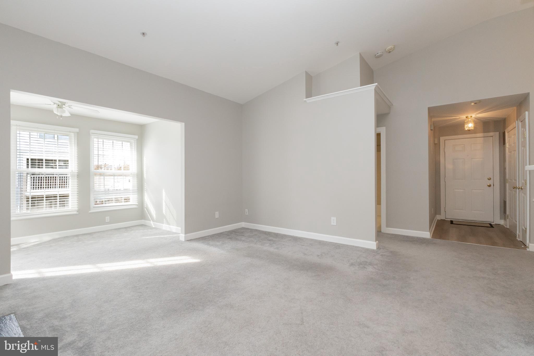8311 Bluebird Way, Unit K Lorton, VA 22079 - Photo 3 of 25 a view of an empty room with a window