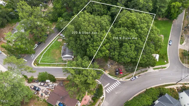 a view of a balcony with two chairs and a potted plant