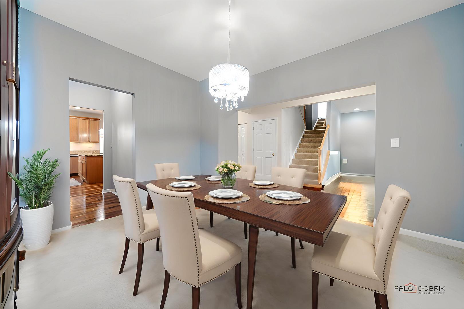 683 Niagara Drive Volo, IL 60073 - Photo 7 of 25 a view of a dining room with furniture and chandelier