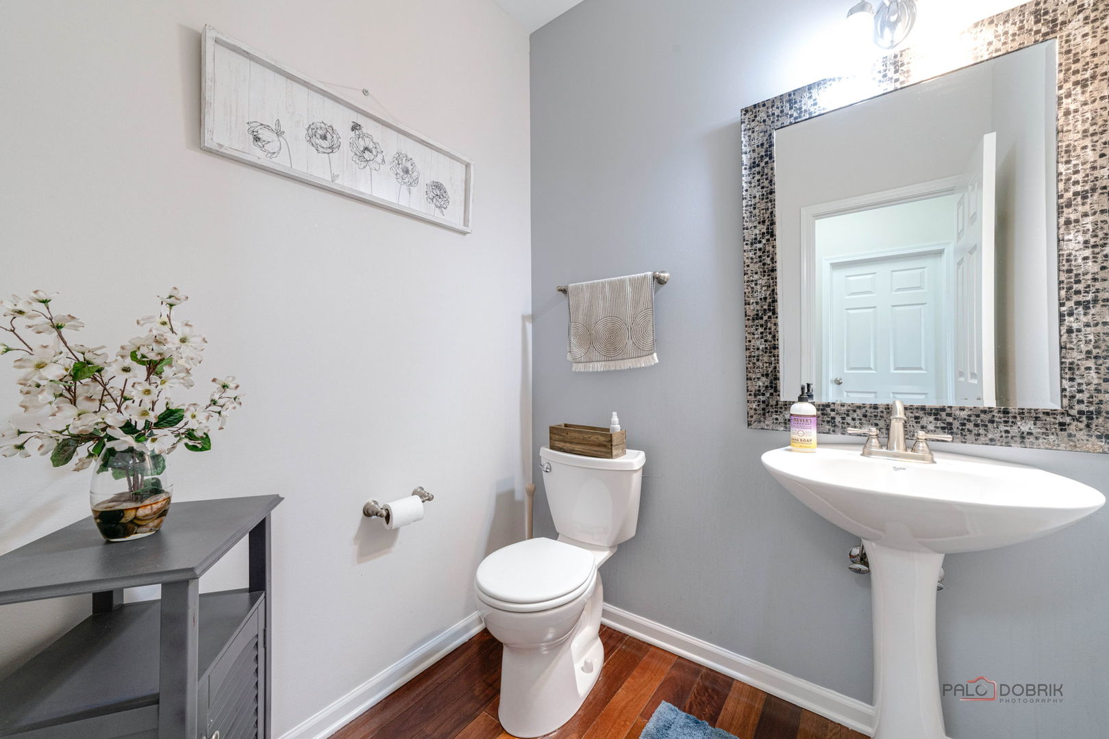 683 Niagara Drive Volo, IL 60073 - Photo 9 of 25 a bathroom with a toilet sink and mirror