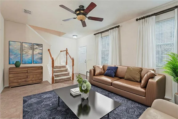 a living room with furniture and a rug