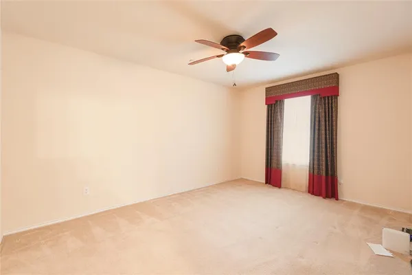 a view of a big room with carpet