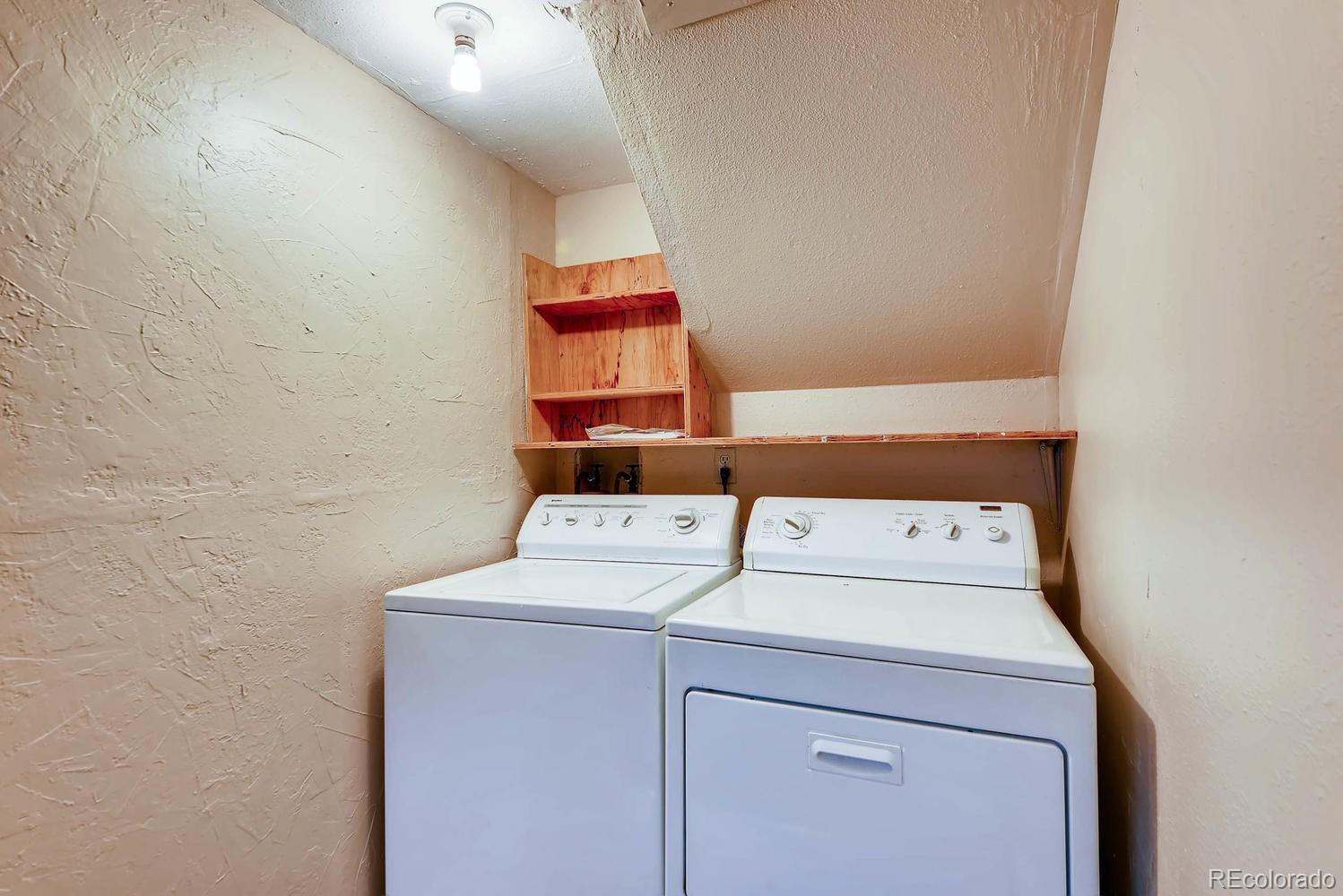 2874 South Genoa Street Aurora, CO 80013 - Photo 20 of 22 a utility room with dryer and washer