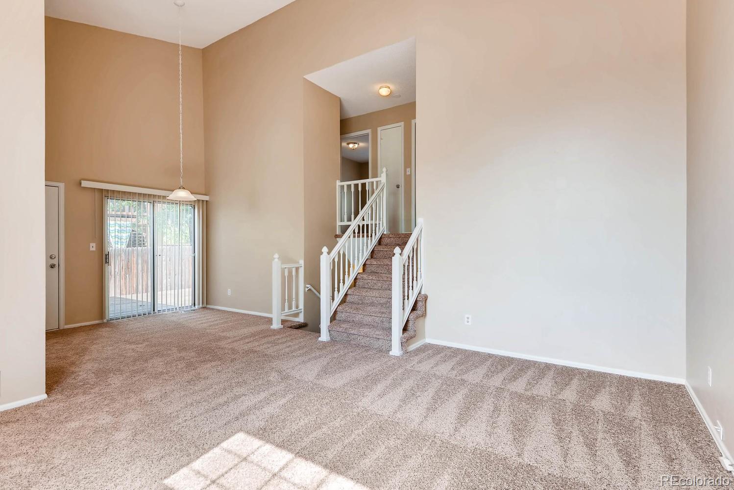 2874 South Genoa Street Aurora, CO 80013 - Photo 5 of 22 a view of an empty room with a window
