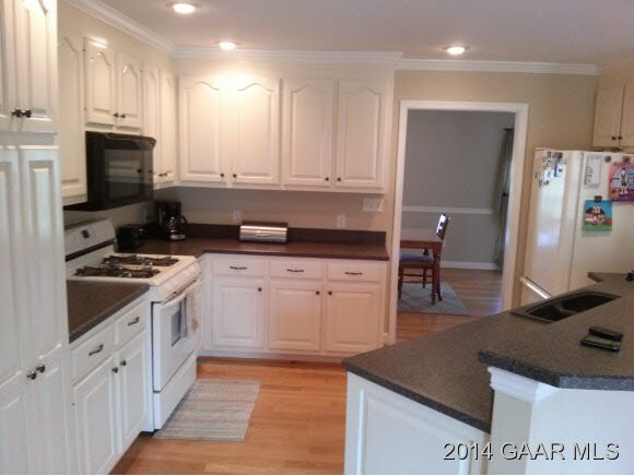 699 Barnhart Road Fort Defiance, VA 24437 - Photo 10 of 26 a kitchen with granite countertop a sink a stove and refrigerator