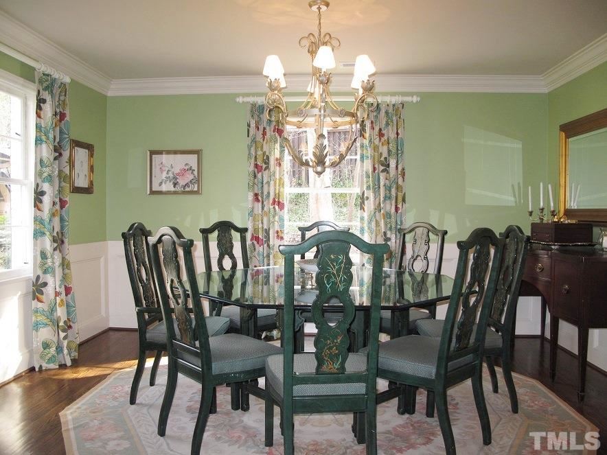 2405 Tyson Street Raleigh, NC 27612 - Photo 5 of 24 a view of a dining room with furniture window and wooden floor