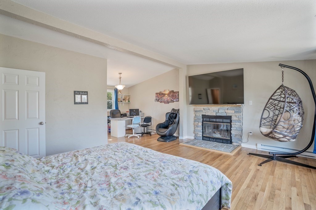 55 Gates Road Saugus, MA 01906 - Photo 13 of 42 a bedroom with a bed and a flat screen tv