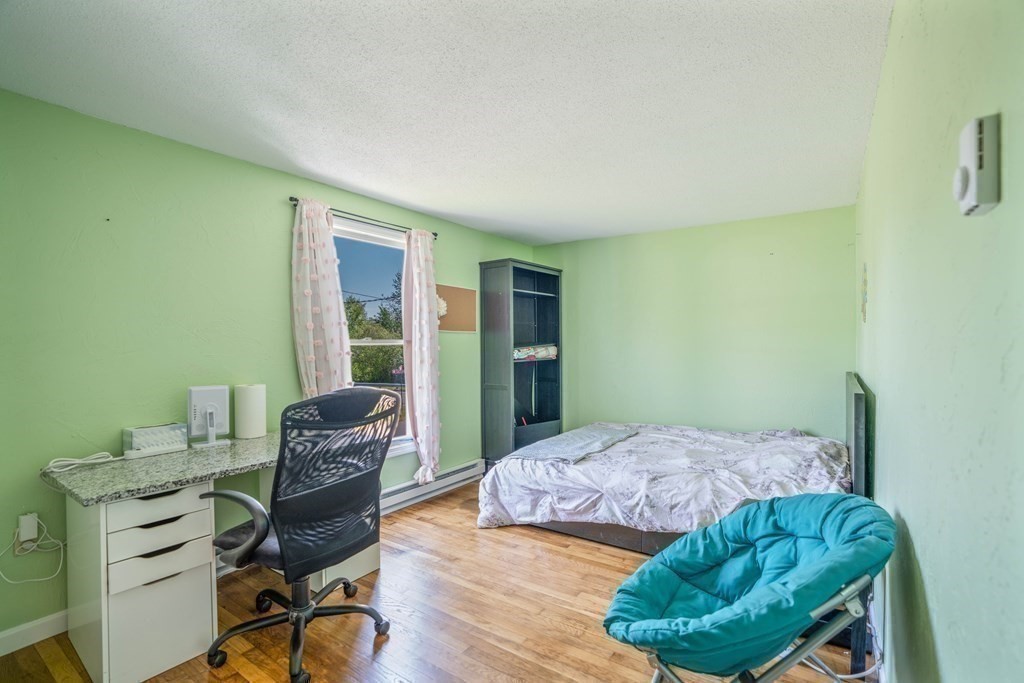 55 Gates Road Saugus, MA 01906 - Photo 18 of 42 a bedroom with a bed and a window