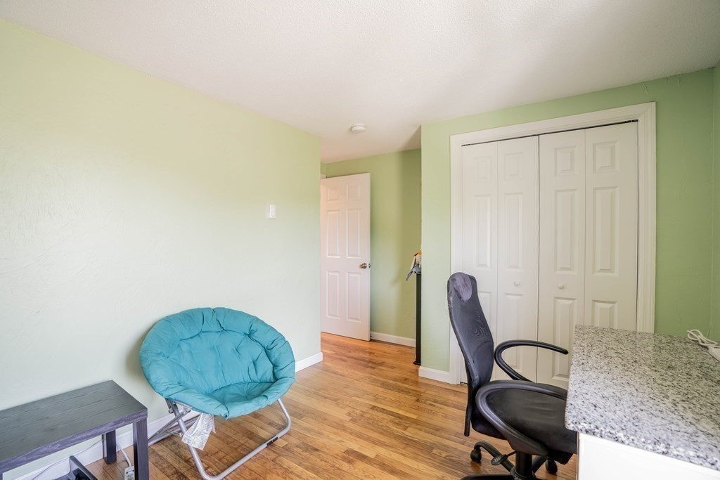 55 Gates Road Saugus, MA 01906 - Photo 19 of 42 a view of a workspace with furniture and a window