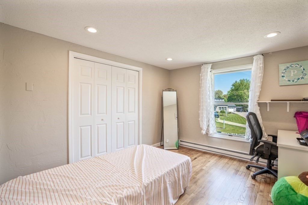 55 Gates Road Saugus, MA 01906 - Photo 22 of 42 a bedroom with a bed and a desk