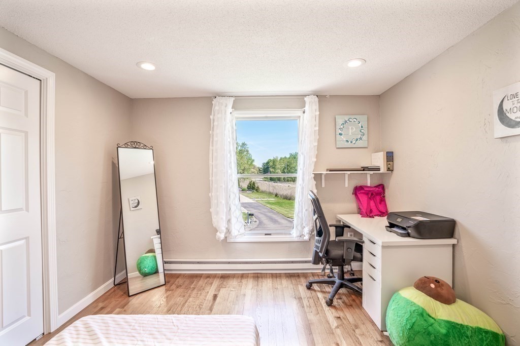 55 Gates Road Saugus, MA 01906 - Photo 23 of 42 a view of a workspace with furniture and a window