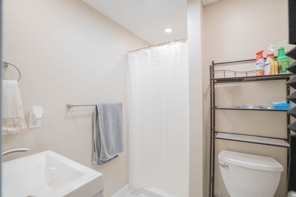 55 Gates Road Saugus, MA 01906 - Photo 24 of 42 a bathroom with a sink a toilet and shower