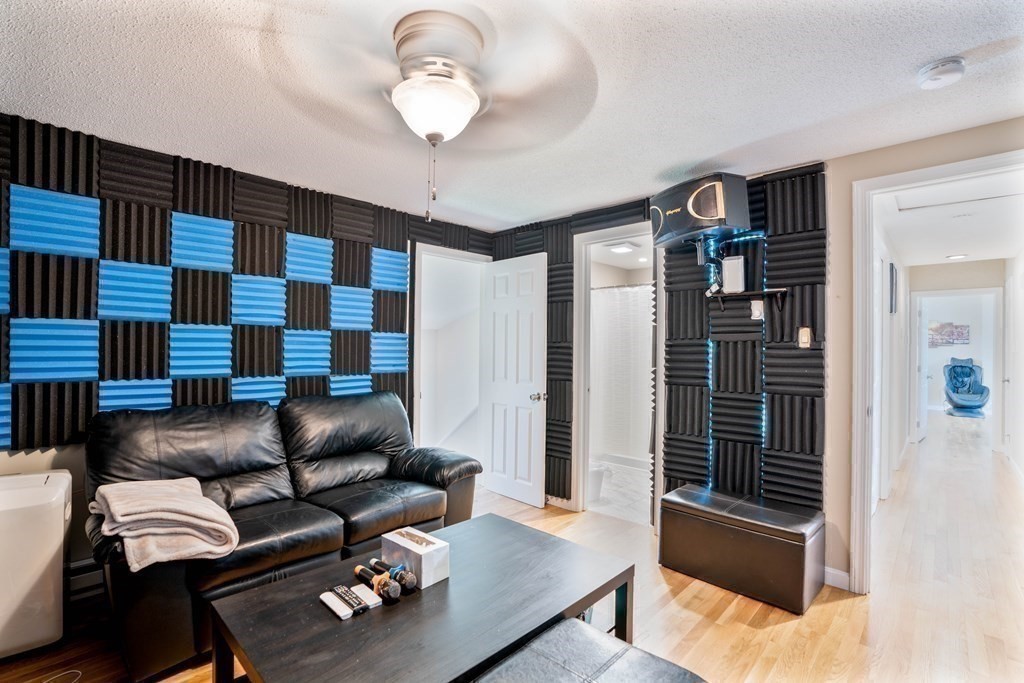 55 Gates Road Saugus, MA 01906 - Photo 26 of 42 a living room with furniture and wooden floor