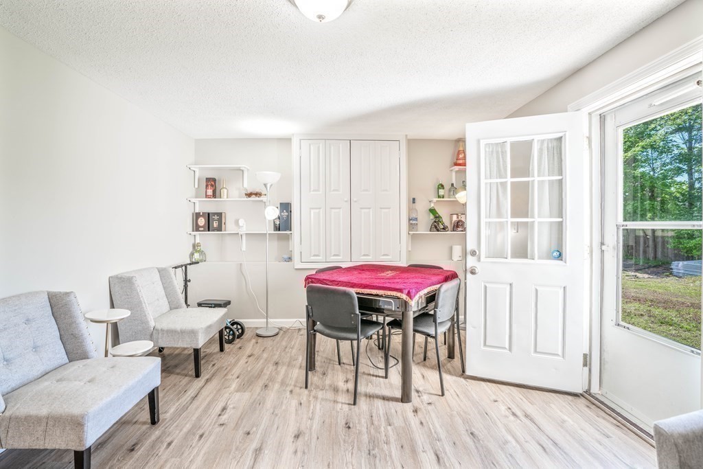 55 Gates Road Saugus, MA 01906 - Photo 27 of 42 a living room with furniture and a wooden floor