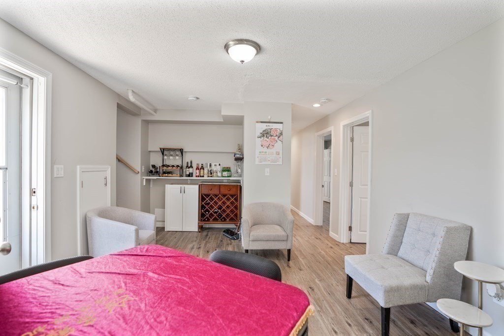 55 Gates Road Saugus, MA 01906 - Photo 28 of 42 a bedroom with a bed and a chair