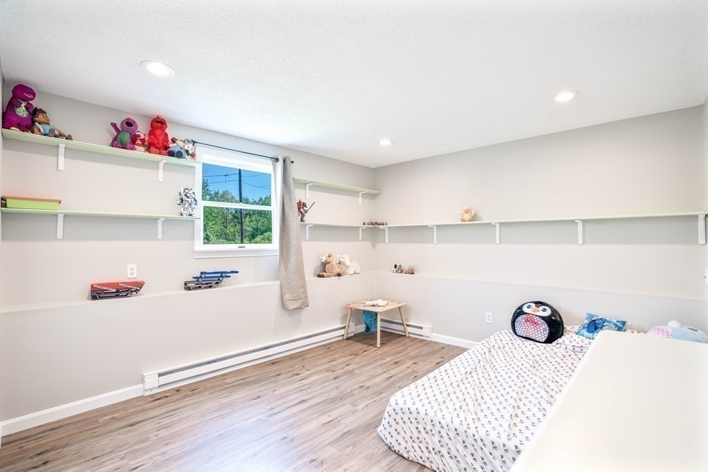 55 Gates Road Saugus, MA 01906 - Photo 29 of 42 a bedroom with a bed and a window