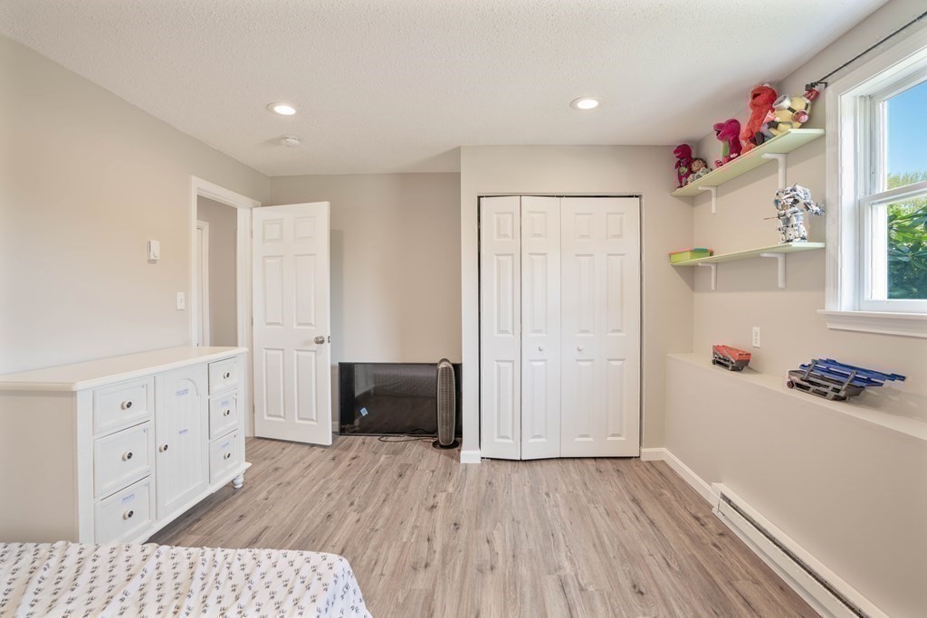 55 Gates Road Saugus, MA 01906 - Photo 30 of 42 a view of livingroom with hardwood floor and cabinet