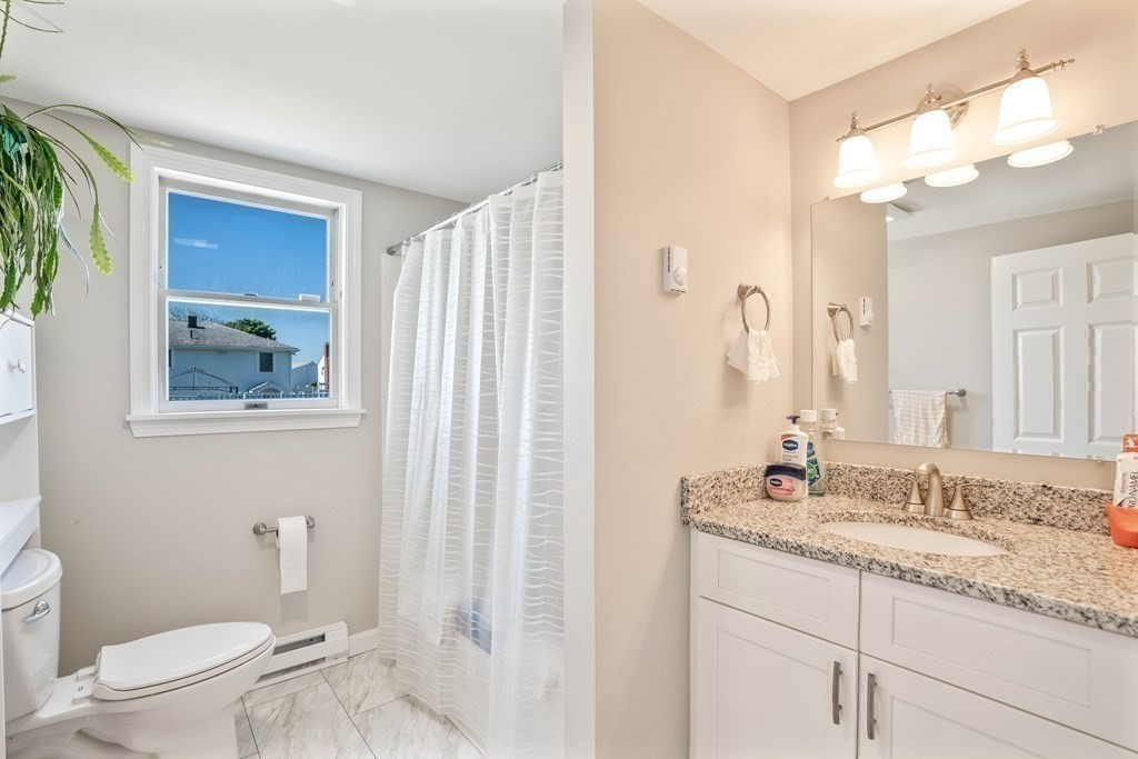 55 Gates Road Saugus, MA 01906 - Photo 31 of 42 a bathroom with a granite countertop sink toilet and shower