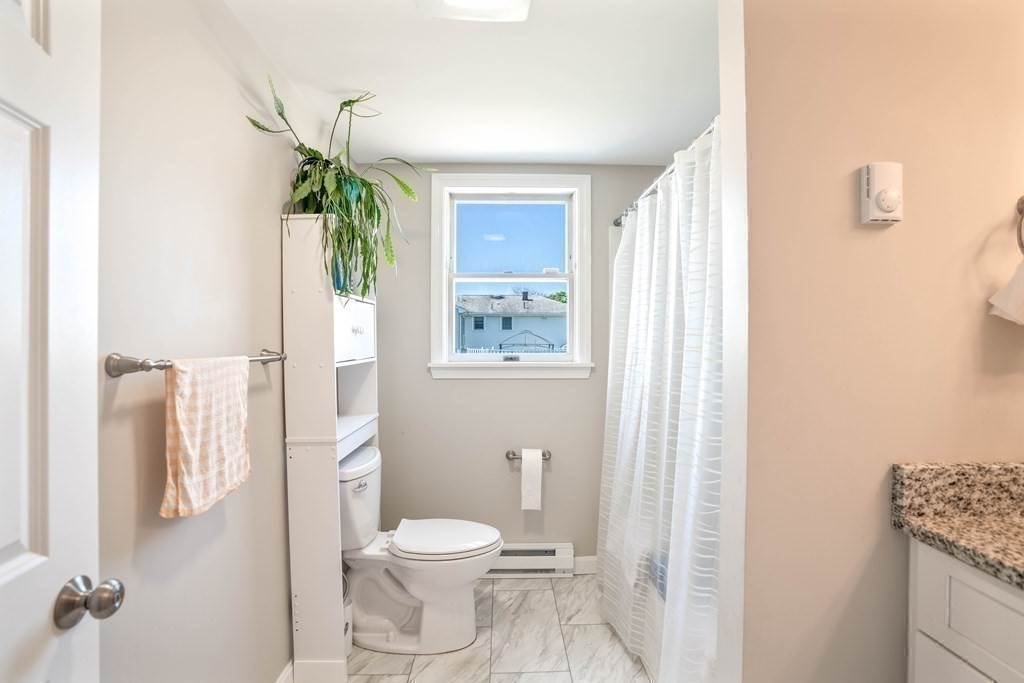 55 Gates Road Saugus, MA 01906 - Photo 32 of 42 a bathroom with a toilet a sink and shower