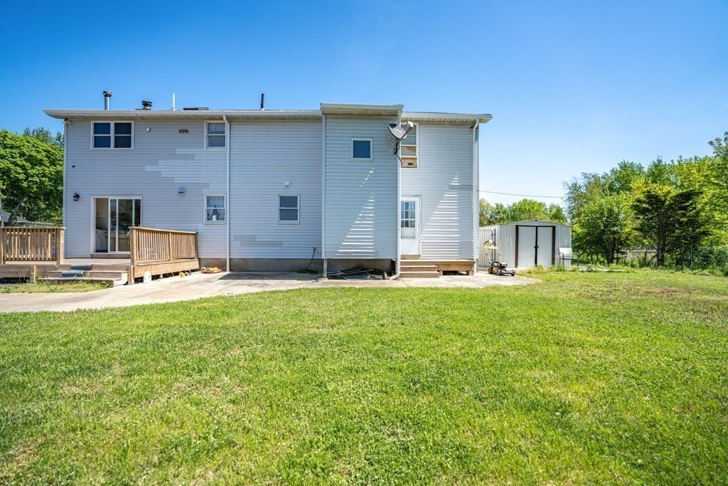 55 Gates Road Saugus, MA 01906 - Photo 36 of 42 a view of a house with a backyard