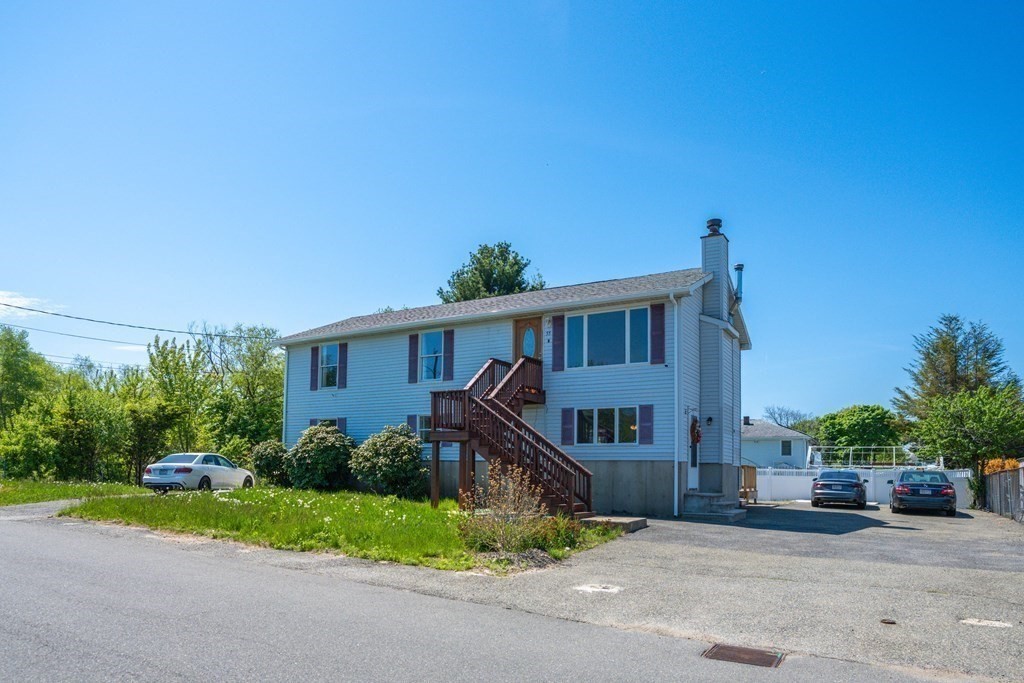55 Gates Road Saugus, MA 01906 - Photo 37 of 42 a view of a house with a yard and plants
