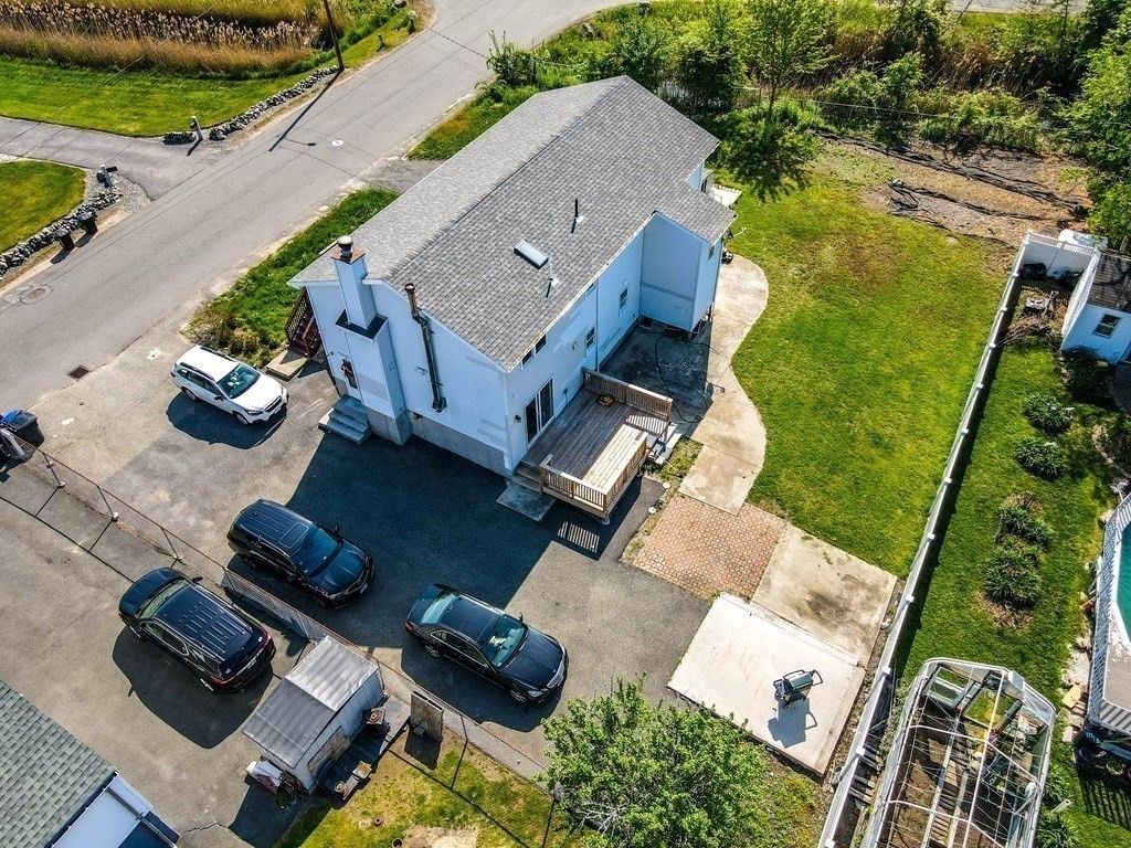 55 Gates Road Saugus, MA 01906 - Photo 39 of 42 an aerial view of a house with a yard