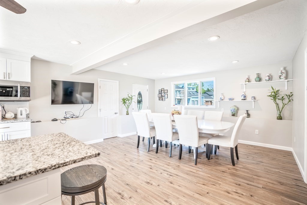 55 Gates Road Saugus, MA 01906 - Photo 6 of 42 a view of a dining room with furniture and wooden floor