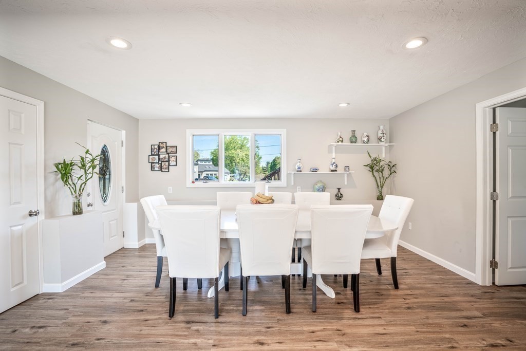 55 Gates Road Saugus, MA 01906 - Photo 8 of 42 a view of a dining room with furniture and wooden floor