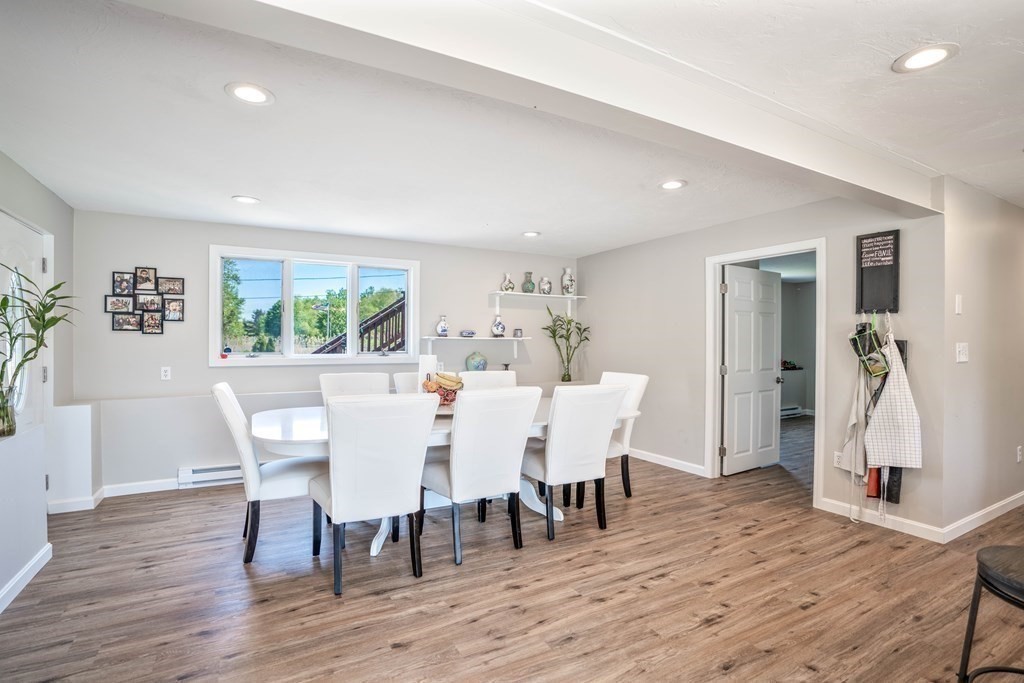 55 Gates Road Saugus, MA 01906 - Photo 9 of 42 a view of a dining room with furniture window and wooden floor
