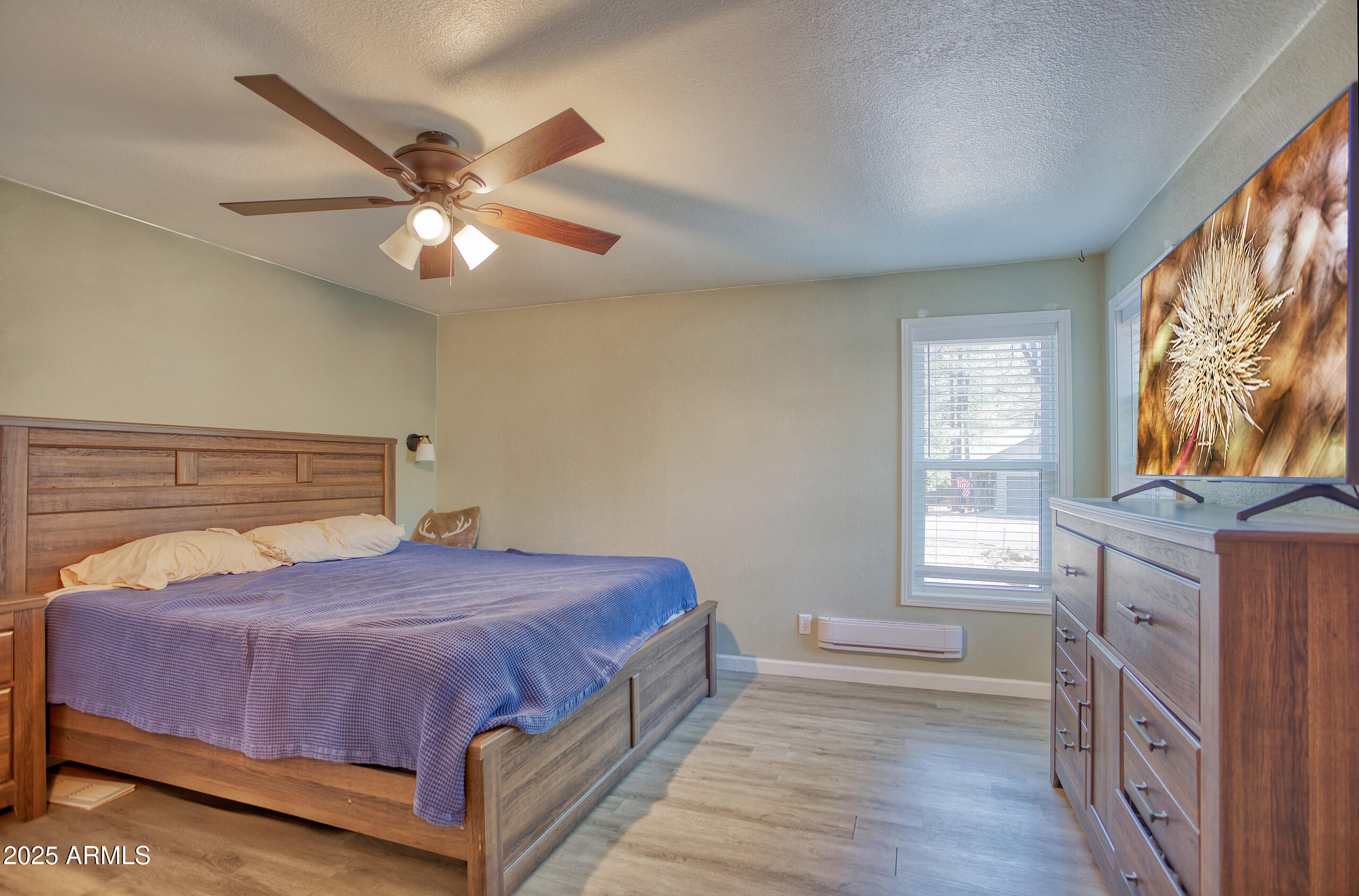 17090 Iron Springs Road Munds Park, AZ 86017 - Photo 27 of 68 a bedroom with a bed and window