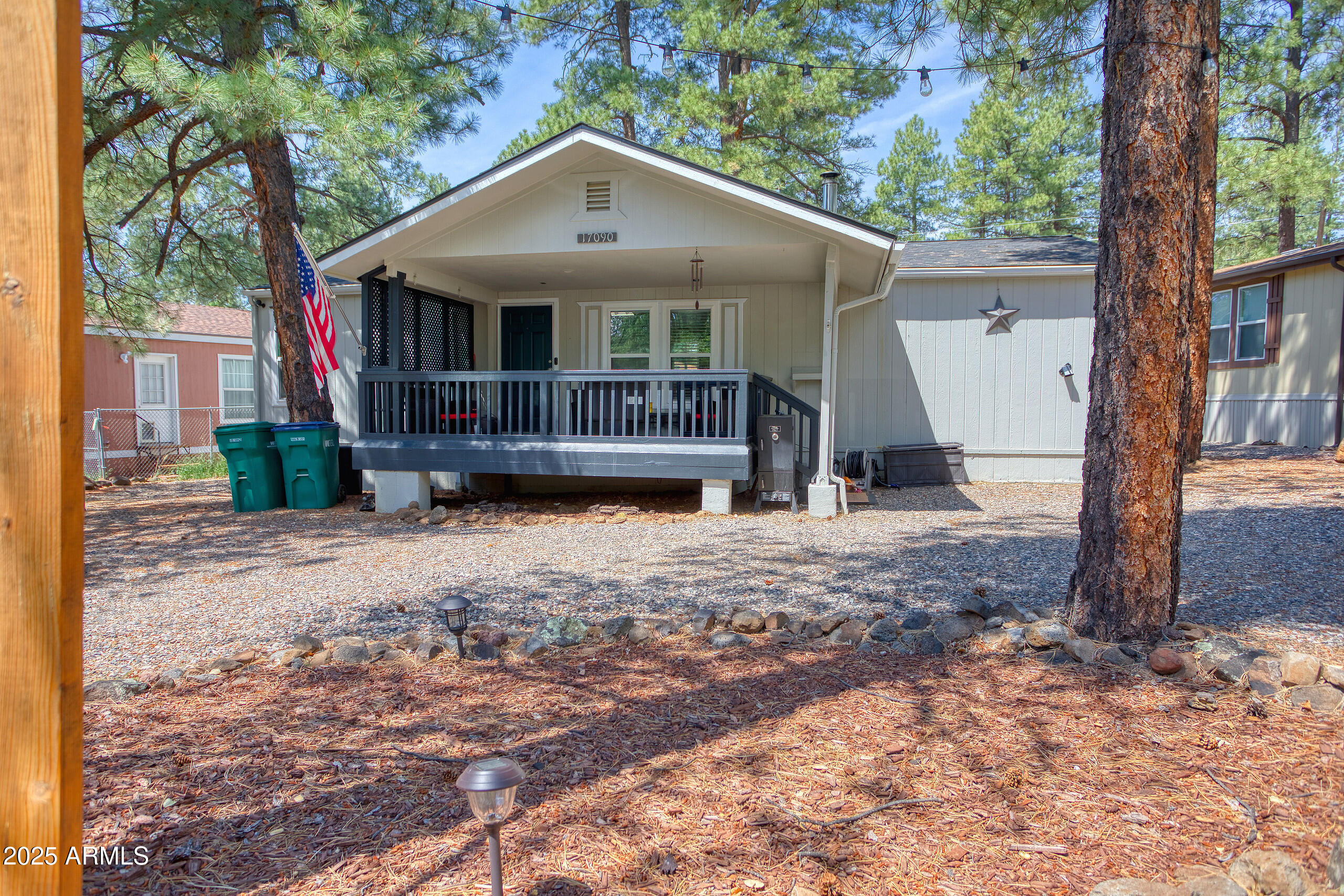 17090 Iron Springs Road Munds Park, AZ 86017 - Photo 3 of 68 a front view of a house with a yard