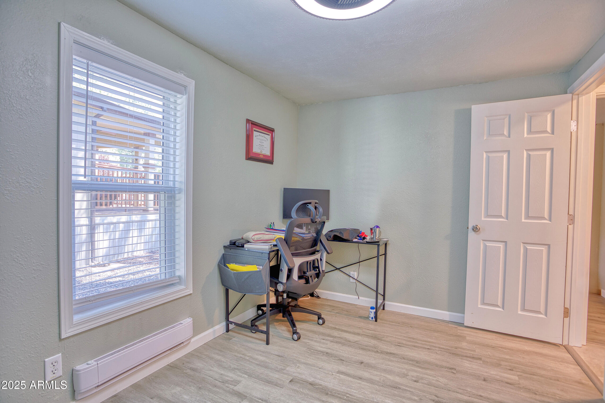 17090 Iron Springs Road Munds Park, AZ 86017 - Photo 40 of 68 a workspace with furniture and a window