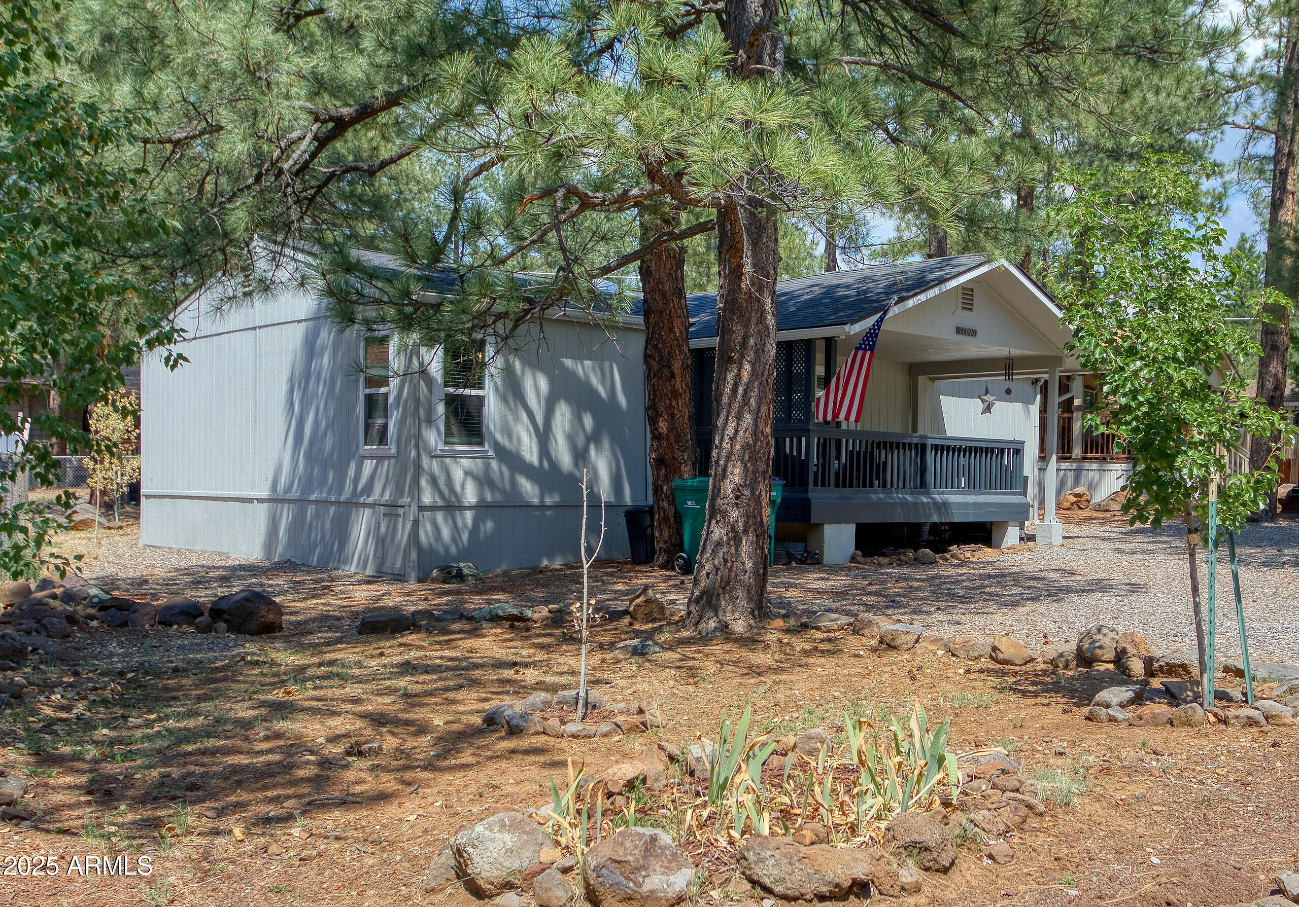 17090 Iron Springs Road Munds Park, AZ 86017 - Photo 59 of 68 a house with a tree in front of it
