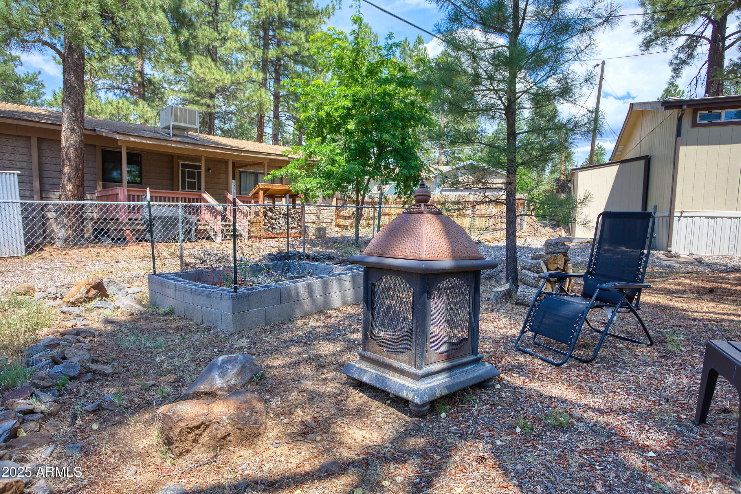 17090 Iron Springs Road Munds Park, AZ 86017 - Photo 63 of 68 a view of a house with backyard and sitting area