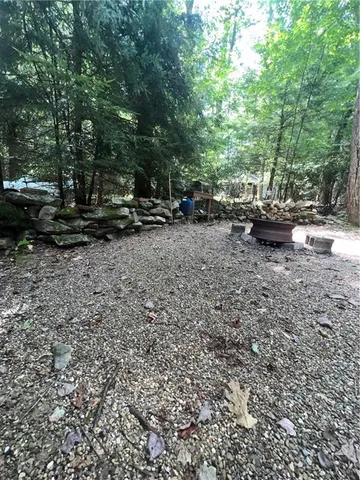 a view of outdoor space with deck and yard
