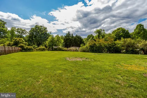 a view of outdoor space with deck and trees