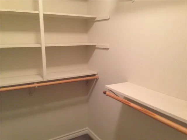 an empty room with a mirror