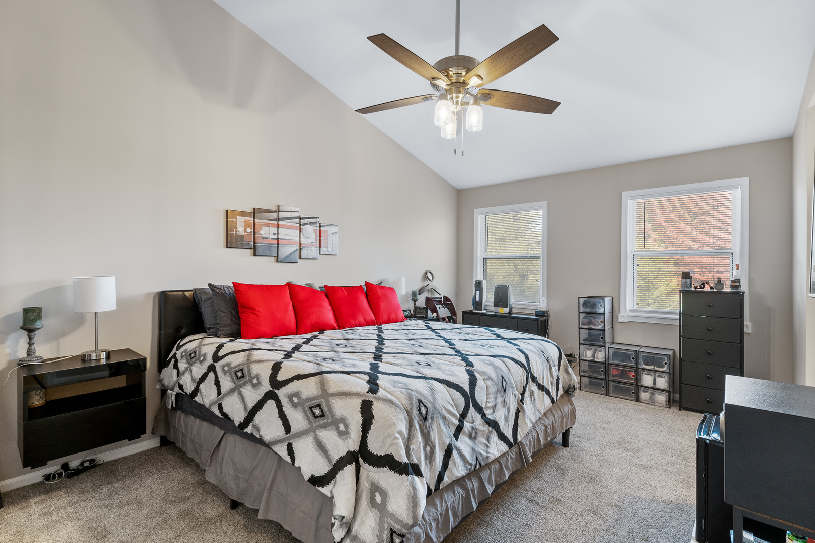 413 Ballard Drive Algonquin, IL 60102 - Photo 12 of 35 a bedroom with a large bed and a chandelier