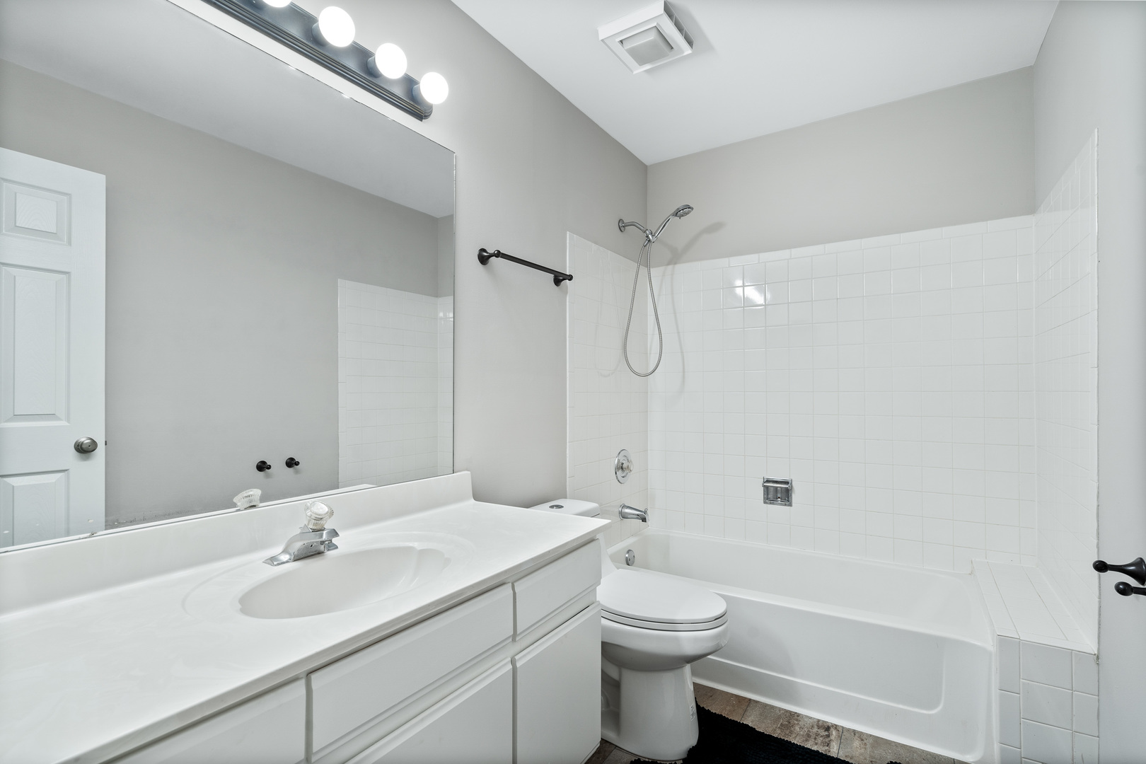 413 Ballard Drive Algonquin, IL 60102 - Photo 15 of 35 a bathroom with a toilet a sink a mirror a bathtub and shower