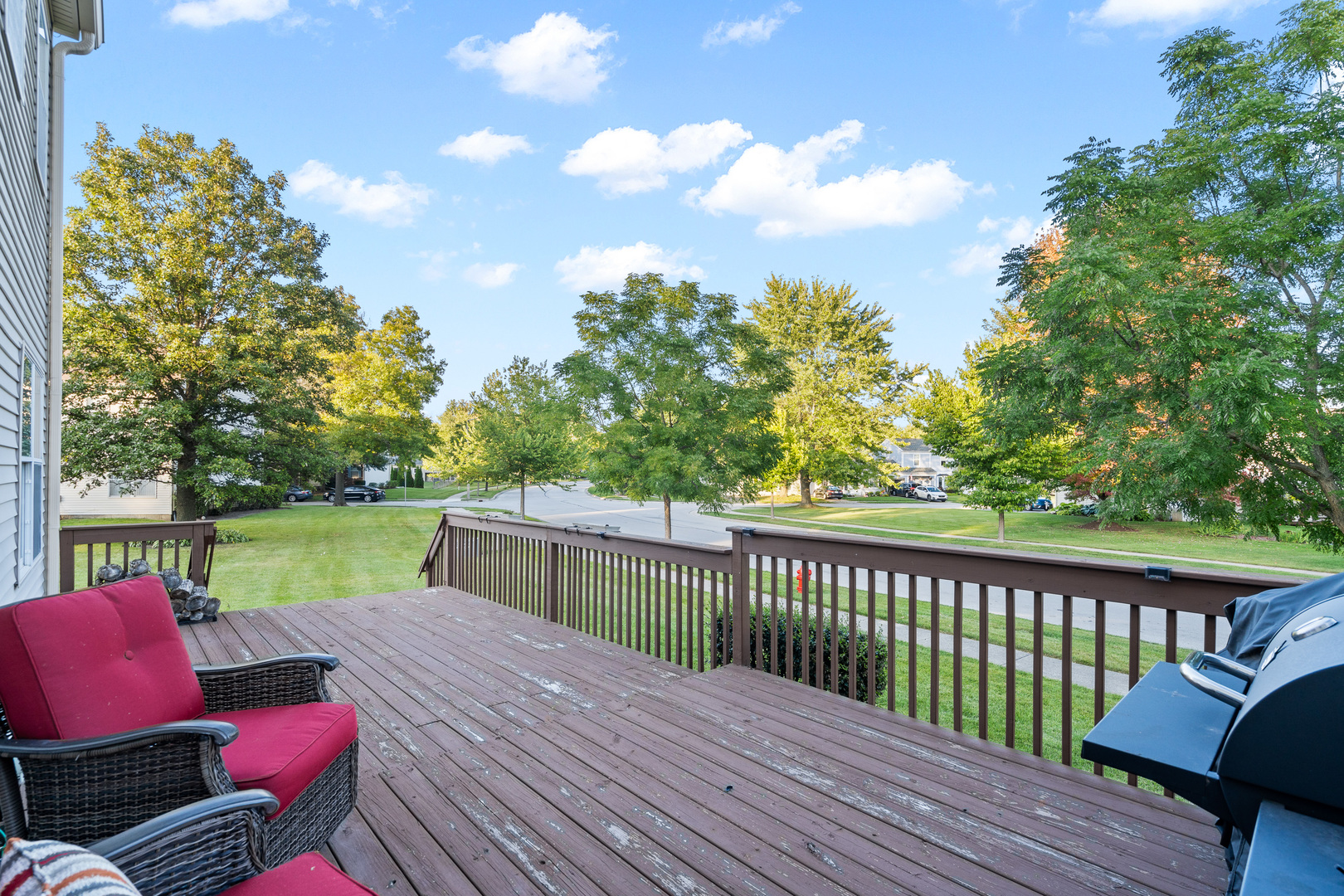 413 Ballard Drive Algonquin, IL 60102 - Photo 9 of 35 a view of a deck with chairs a barbeque with wooden floor and fence